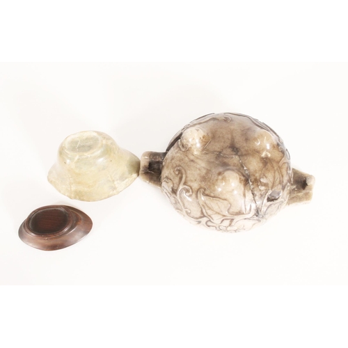 354 - Chinese russet jade cap carved with a dragon atop clouds, together with a two handled round bowl, re... 