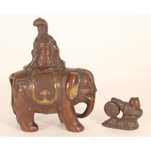 367 - Japanese bronzed metal figure of a musician atop an elephant, together with a small Japanese bronze ... 