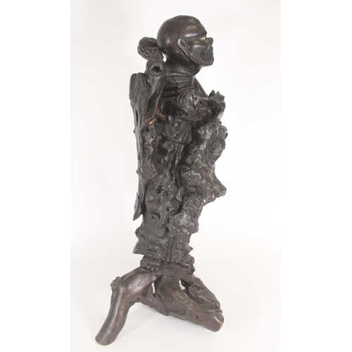 370 - Large Chinese lacquered root wood figure of Damo, the ascetic monk shouldering a club with bowl in h... 