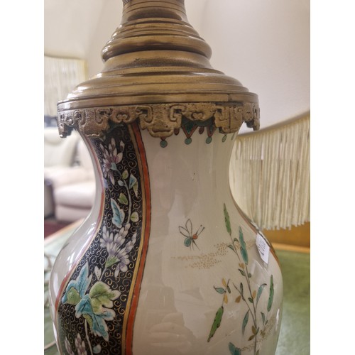 600 - A pair of large table lamps with brass base and fittings in Oriental floral pattern, 54cm high to ba... 