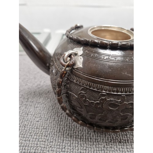 167 - Oriental tea pot with four cups, white metal lining and fixings, 'nut' inside pot, impressed mark in... 