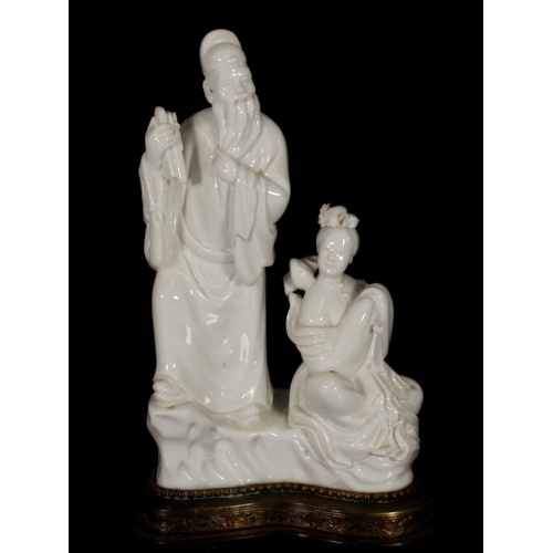 380 - Chinese blanc de chine porcelain figurine of Guanyin seated on Denglong, together with another blanc... 