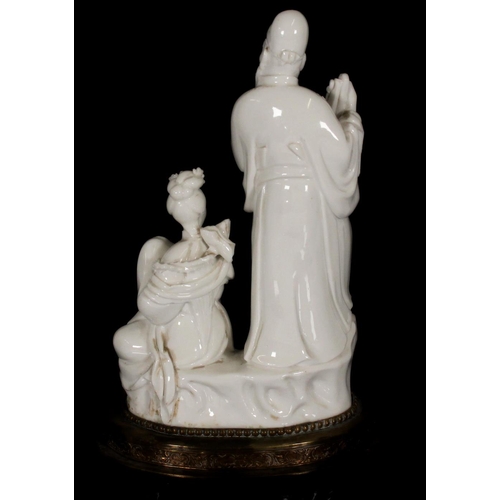 380 - Chinese blanc de chine porcelain figurine of Guanyin seated on Denglong, together with another blanc... 