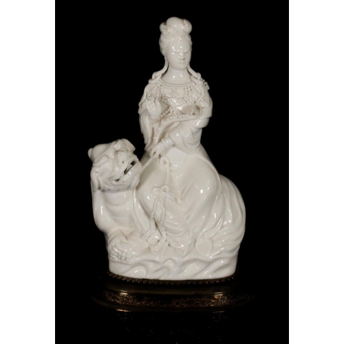 380 - Chinese blanc de chine porcelain figurine of Guanyin seated on Denglong, together with another blanc... 