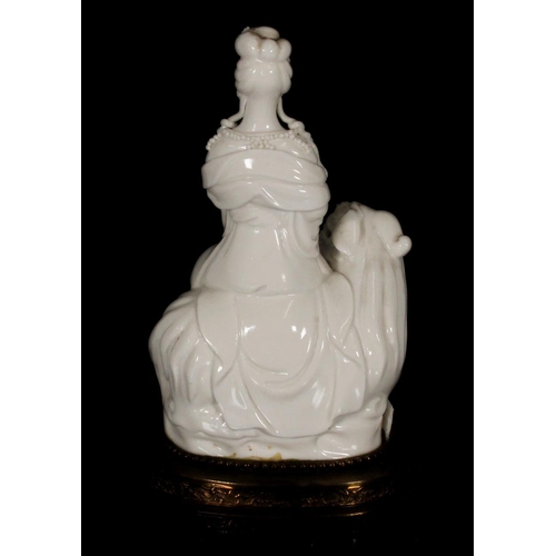 380 - Chinese blanc de chine porcelain figurine of Guanyin seated on Denglong, together with another blanc... 