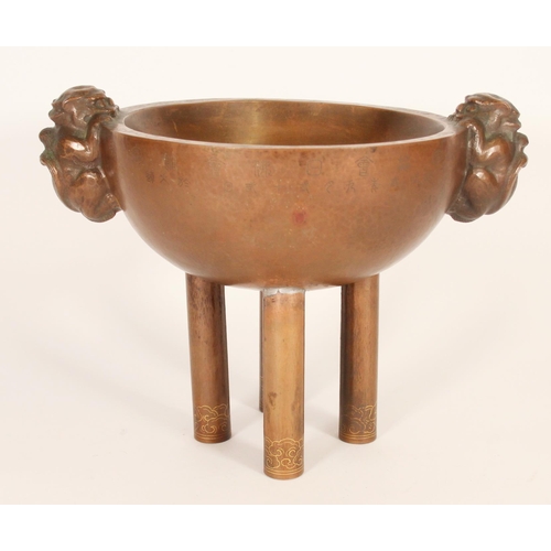 381 - Chinese patinated hollow metal censer, the planished bowl with cast temple dog handles, engraved wit... 