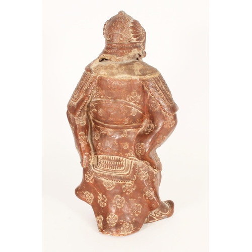 383 - Chinese red clay figure of a warrior in traditional armour, holding a scroll in left hand, H33cm.