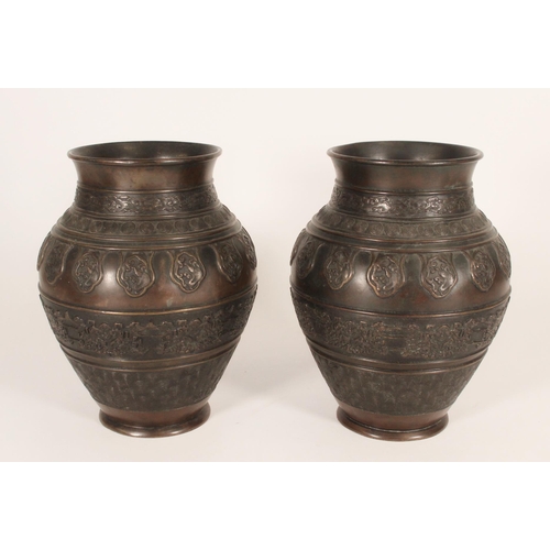 393 - Pair of Chinese bronze baluster vases, decorated in the bands with repeating clouds, targets, waves ... 