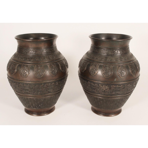 393 - Pair of Chinese bronze baluster vases, decorated in the bands with repeating clouds, targets, waves ... 