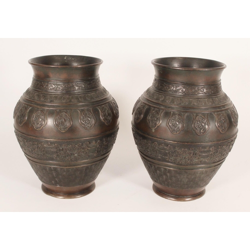 393 - Pair of Chinese bronze baluster vases, decorated in the bands with repeating clouds, targets, waves ... 