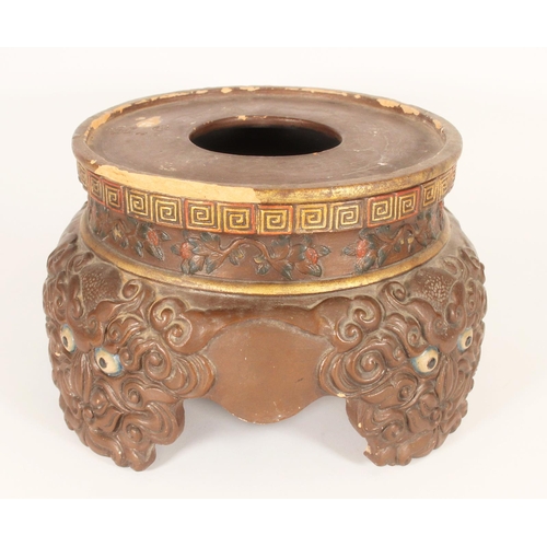 394 - Large Japanese painted terracotta stand, the key fret border over a floral band, on four stylised On... 