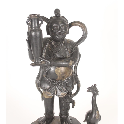 395 - Chinese cast painted bronze figural incense holder of a boy holding a vase, on naturalistic base wit... 