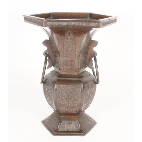 396 - Chinese bronze archaic style vase, of hexagonal form with flared rim and loop handles, decorated wit... 