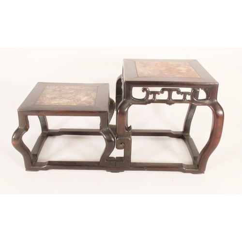 397 - Chinese hardwood two tier stand, the stands inset with mottled marble panels above a pierced apron w... 