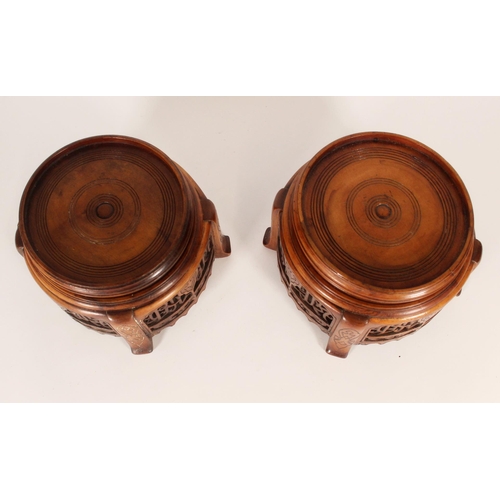 413 - Pair of Chinese export hardwood stands, of round form with pierced Islamic script aprons on shaped l... 