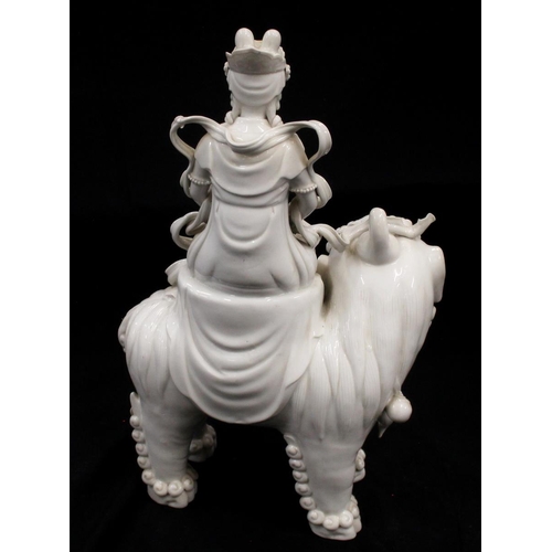 415 - Chinese Blanc de Chine porcelain model of a Boddishattva seated on a Dog of Fo, H42cm.