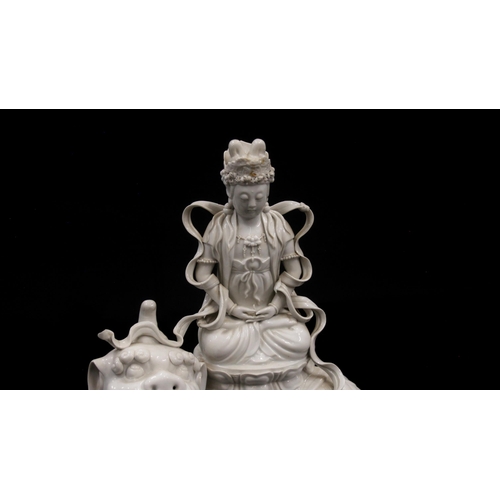 415 - Chinese Blanc de Chine porcelain model of a Boddishattva seated on a Dog of Fo, H42cm.