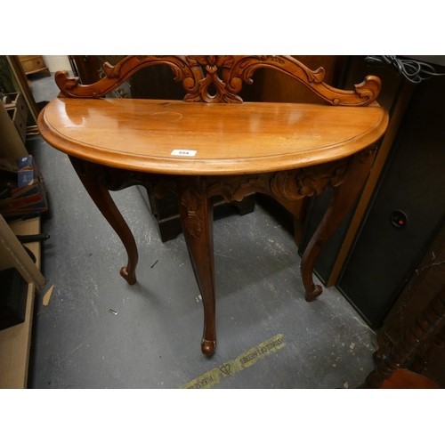 513 - Mahogany demi lune hall table.