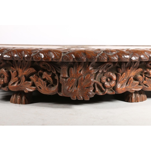 300 - Victorian carved oak revolving Lazy Susan, the plain top with central Welsh dragon, acorn and oak le... 