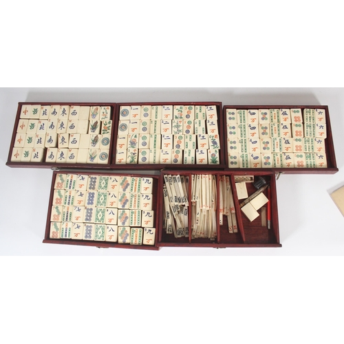 296 - Mah Jong set, early to mid 20th century, the wooden and metal bound case with five drawers of bamboo... 