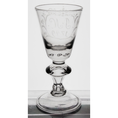 304 - George II baluster wine glass, the round funnel bowl engraved J.N. 1749 within floral frame, the bow... 