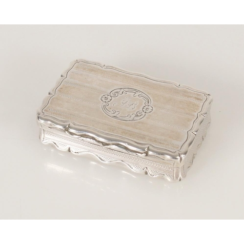 74 - Antique Victorian silver snuff box of rectangular shape having serpentine edge and engine turned dec... 