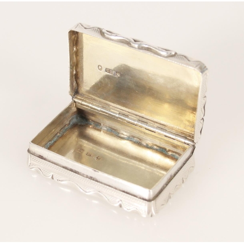 74 - Antique Victorian silver snuff box of rectangular shape having serpentine edge and engine turned dec... 