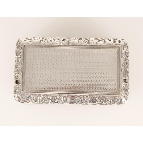 75 - Antique George IV silver snuff box of rectangular form having engine turned decoration and chased fl... 