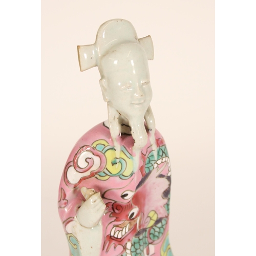 330 - Chinese Famille Rose figure of an Immortal, 19th century, the flowing robe decorated with dragon amo... 