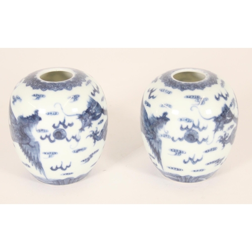 340 - Pair of Chinese porcelain dragon and phoenix vases, late Qing period, the ovoid bodies finely decora... 