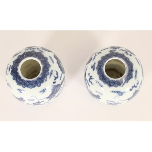 340 - Pair of Chinese porcelain dragon and phoenix vases, late Qing period, the ovoid bodies finely decora... 