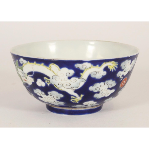 342 - Chinese white dragon bowl, late Qing period, the white dragon with green mane chasing a red flaming ... 