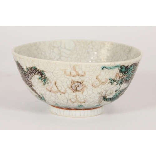 343 - Chinese porcelain Famille Verte green dragon bowl, Qing period, the green enamelled dragons chasing ... 