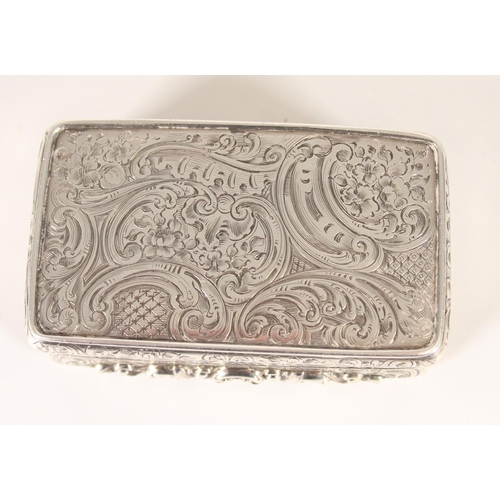 81 - Antique Victorian silver snuff box of rectangular form decorated all over with incised scroll design... 