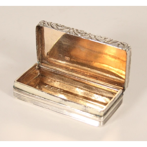 82 - Antique George IV silver snuff box of rectangular shape the top surface with engine turned filed, re... 