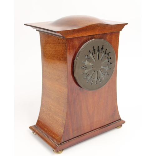 285 - Edwardian mahogany mantel clock, the bulged top over an arching case on four brass feet, the white d... 