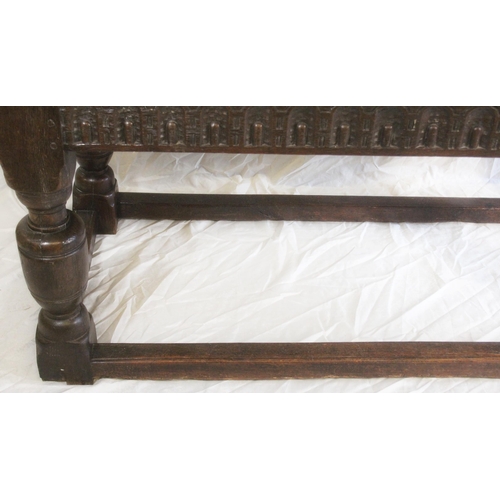 424 - 18th Century oak panel top refectory table, carved skirt above heavy turned column supports, 182cm w... 