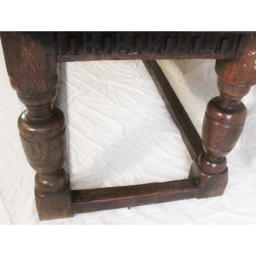 424 - 18th Century oak panel top refectory table, carved skirt above heavy turned column supports, 182cm w... 