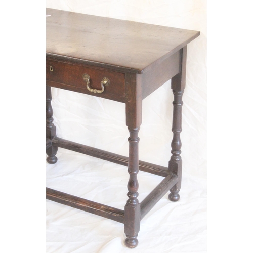 431 - Antique oak single drawer side table, raised on turned supports above four stretchers, 76cm wide x 4... 