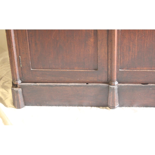 443 - Antique Gothic style mahogany two door sideboard with chamfered coulmns raised on plinth base, 153cm... 