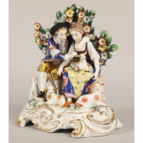 8 - Continental style porcelain figurine, a courting pair with lambs, gold anchor mark of Chelsea Porcel... 