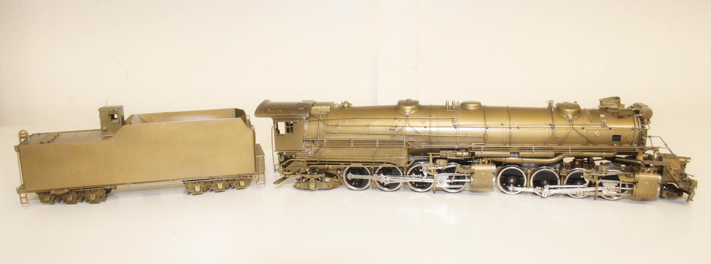 United Scale Models of Tokyo Japan, a 2-8-8-2 locomotive and tender with  golden finish, without box.