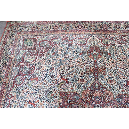 456 - Persian large wool carpet, mid to late 20th century, the central medallion of red background with fo... 