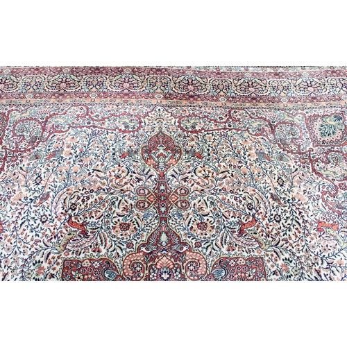 456 - Persian large wool carpet, mid to late 20th century, the central medallion of red background with fo... 