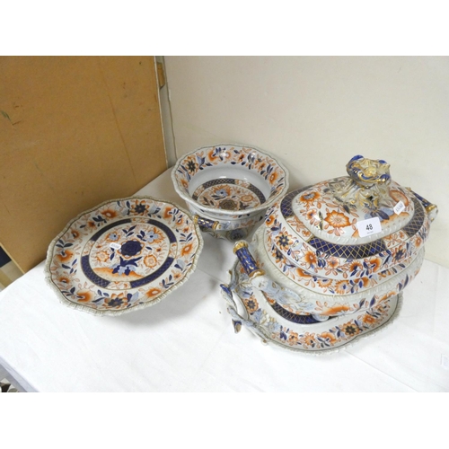 48 - Imari pattern stone china tureen on stand, a similar twin handled comport and a cake stand