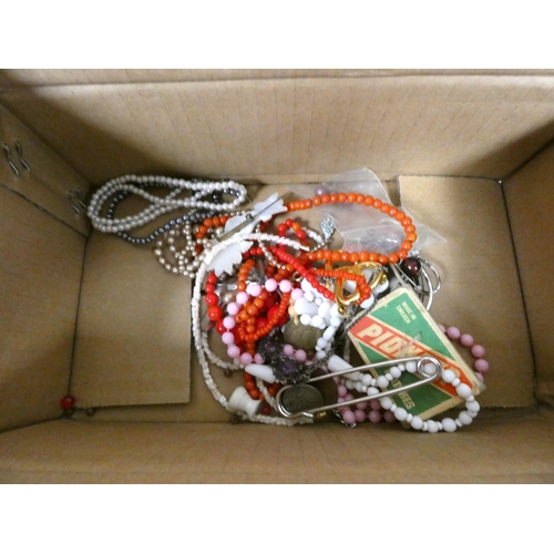 67 - Box of costume jewellery to include black beads.