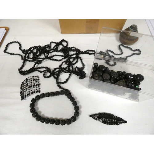 67 - Box of costume jewellery to include black beads.