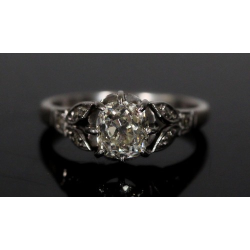 185 - Unmarked platinum diamond engagement ring, the central cushion shape 0.8-1ct diamond flanked by diam... 