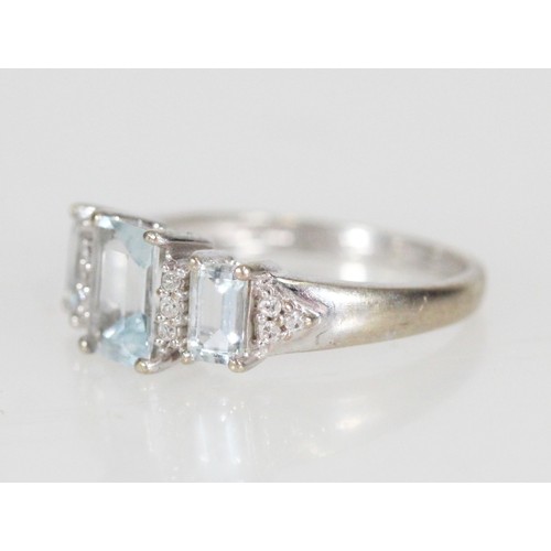 186 - 9ct white gold diamond and aquamarine fifteen-stone dress ring, size L, 2.5g.