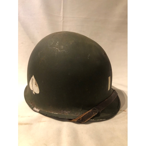 1895 - American WWII style steel helmet with painted decoration in the form of two white spades suggesting ... 